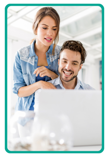 A man and woman looking at a computer