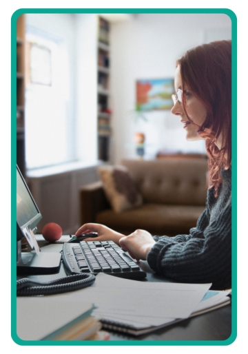 woman looking at a desktop computer